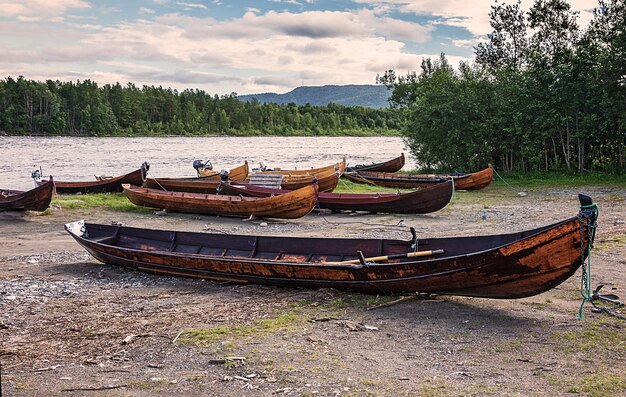 Wooden boats on the river bank, Finnmark, Norway