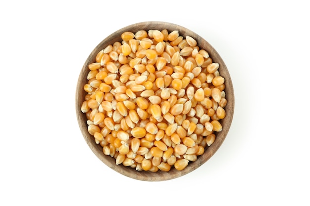 Wooden bowl of corn seeds isolated on white background