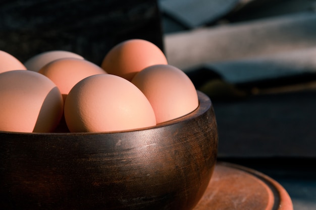 Wooden bowl full of eggs