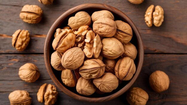 A wooden bowl full of healthy walnuts in hard shells