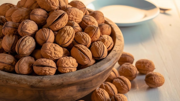 A wooden bowl full of healthy walnuts in hard shells