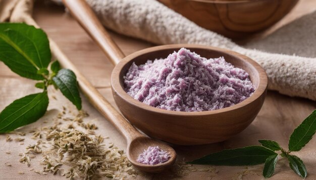 A wooden bowl of purple powder with a spoon in it