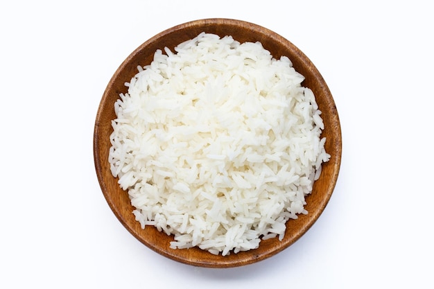 Wooden bowl of rice on white background