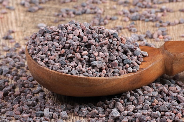 A wooden bowl with chocolate chips on it