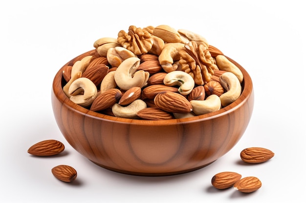 Wooden bowl with mixed nuts on white table top view Healthy food and snack Walnut pistachios alm