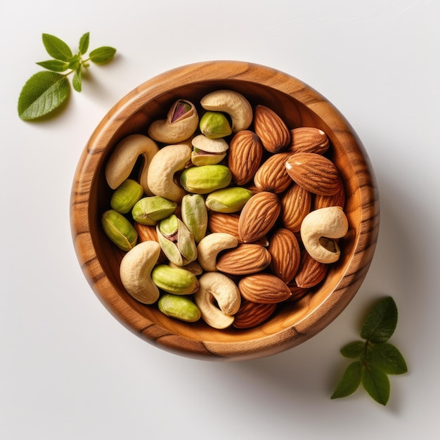 Wooden bowl with mixed nuts on white table top view Pistachios almonds and cashews Generative AI