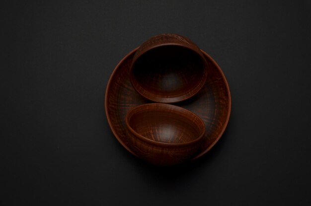 A wooden bowl with a pattern of circles on it