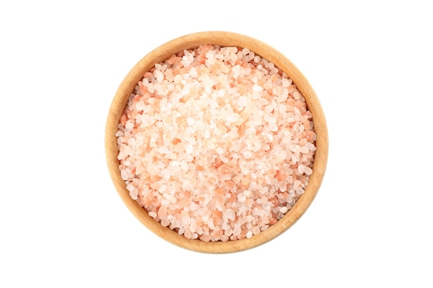 Wooden bowl with pink himalayan salt isolated on white