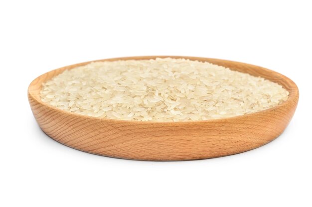 Wooden bowl with raw rice isolated on white