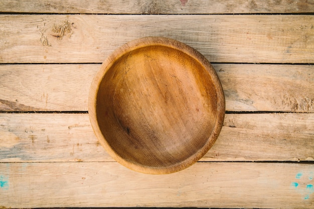 wooden bowls on wood background