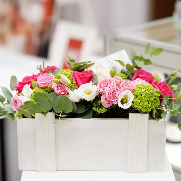 Wooden box as vase with flowers