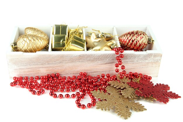 Wooden box filled with christmas decorations isolated 