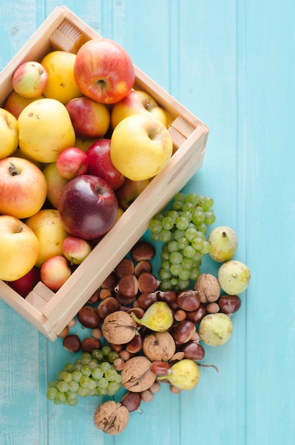 Wooden box with autumn fruits