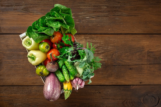 Wooden box with different vegetables Harvesting