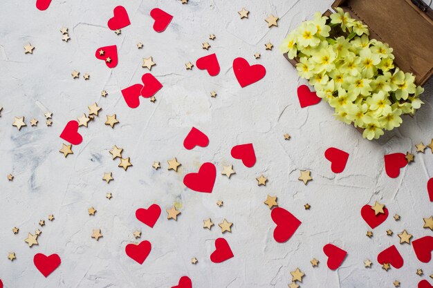 Wooden box with flowers, stars and red hearts.