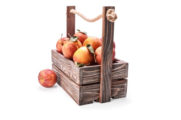 a wooden box with a wooden handle and some apples in it