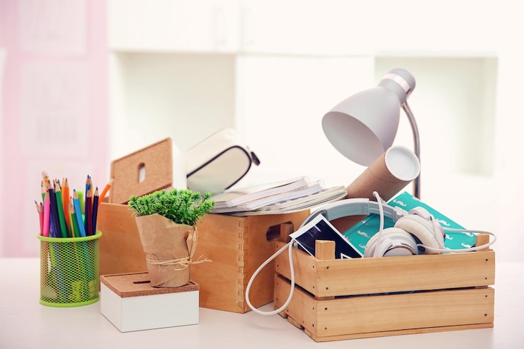 Photo wooden boxes with things for relocation on light table