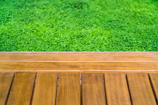 Wooden bridge and green groundcover plants