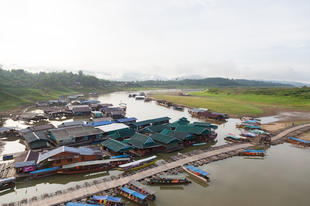 Wooden bridge and houses in water