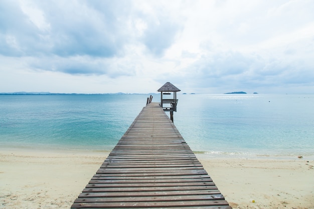 Wooden bridge into the sea.