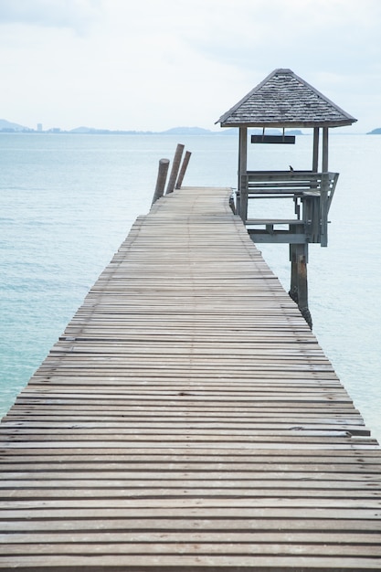 Wooden bridge into the sea.