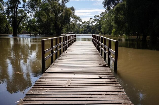 Photo a wooden bridge is in the middle of a lake