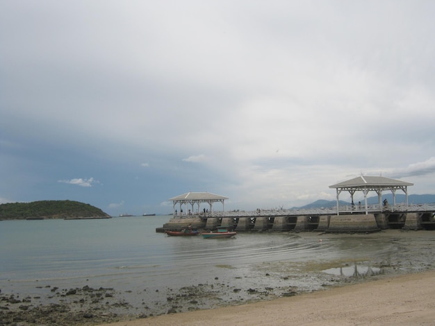 wooden bridge jutting out into the sea