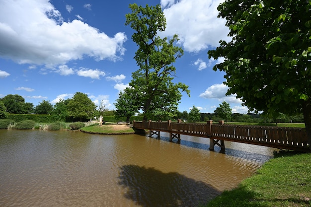 Wooden bridge on pond in Panska Garden Kunstat in Moravia Czech Republic