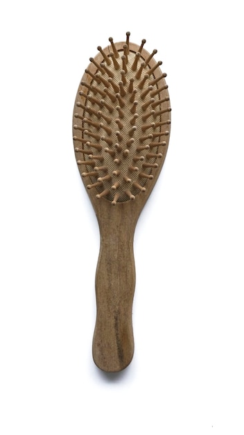 Photo wooden brown hair brush on white background