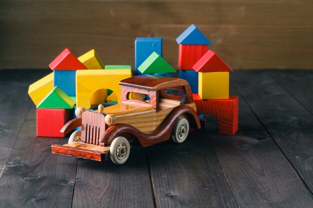 Wooden building blocks on a black