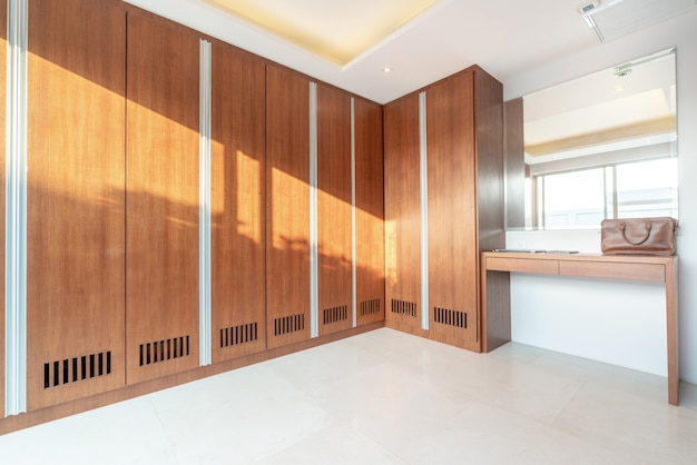 Wooden built in wardrobe with green garden