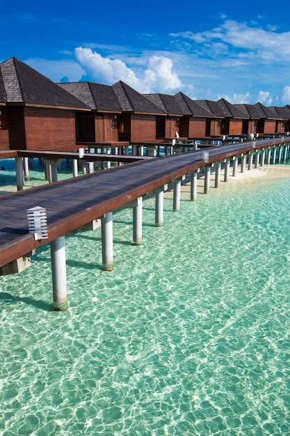 Wooden cabin hotel over the sea in Maldives