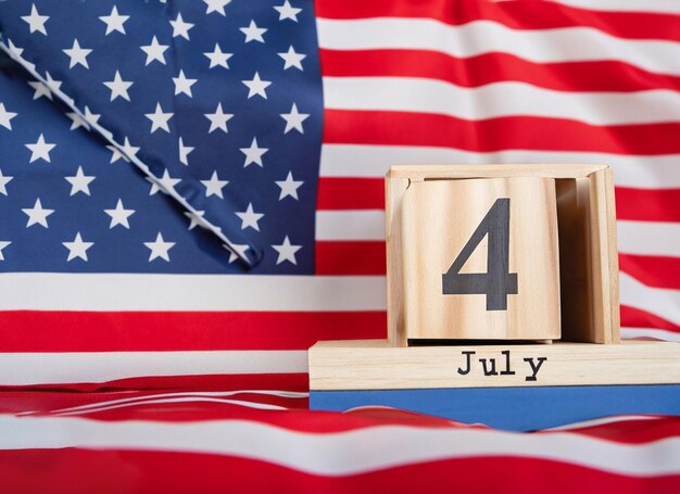 Wooden calendar 4th of July with an American flag generative ai