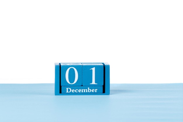 写真 白い背景の上の木製のカレンダー 12 月 1 日