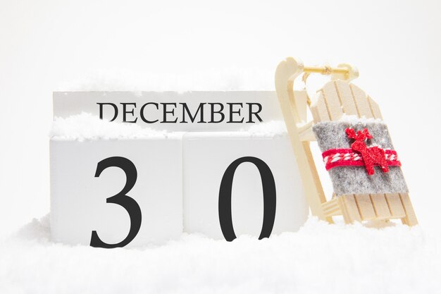 Wooden calendar for December, 30 th day of the winter month. 