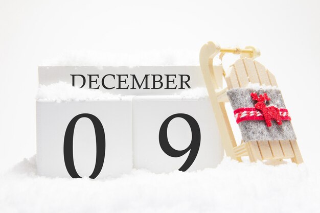 Wooden calendar for December, 9 th day of the winter month. 