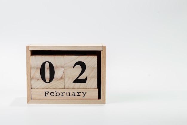 Wooden calendar February 02 on a white background