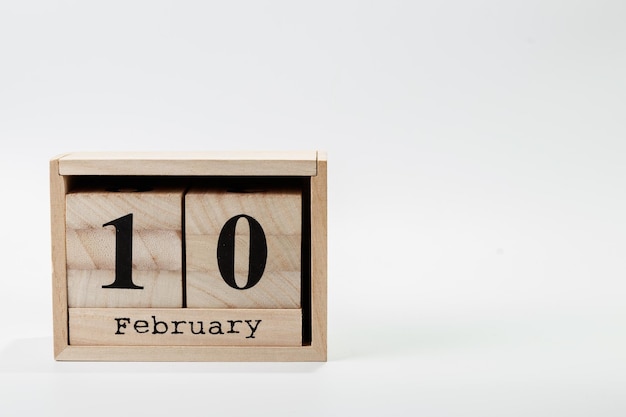 Wooden calendar February 10 on a white background