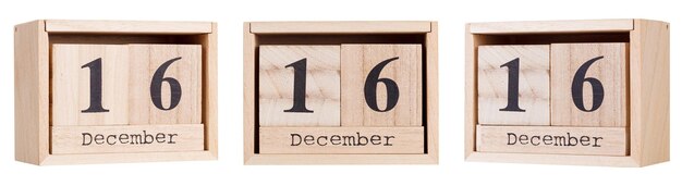 Wooden calendar a set of dates of the month 16 december on a white and transparent background closeup