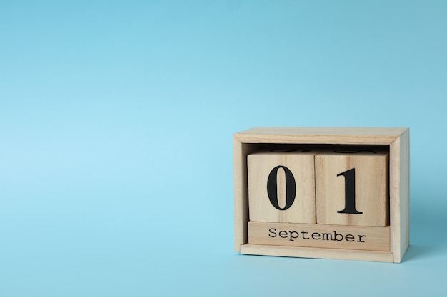 Wooden calendar with date September, space for text