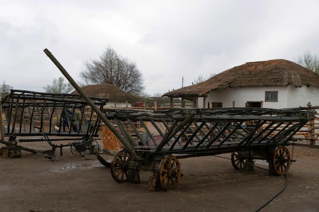 A wooden cart in the village an old freight cart