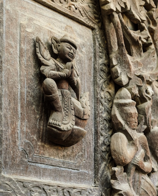 Wooden carving detail at Shwenandaw Kyaung Temple  in Mandalay, Myanmar