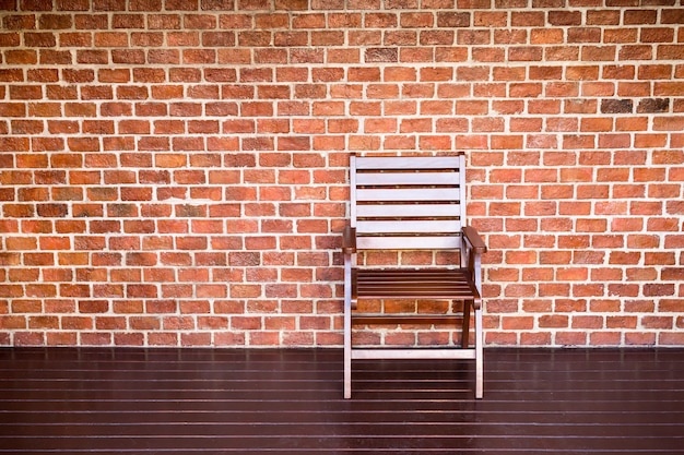 wooden chair and brick wall background