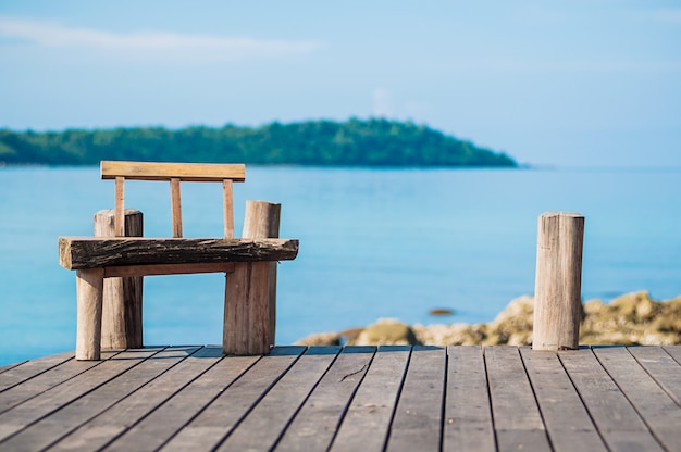 wooden chair near by beautiful sea