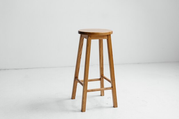 Wooden chair in a white empty room