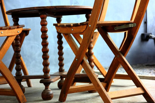 Photo wooden chairs table retro style decoration in the corner