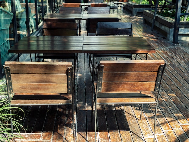 Wooden chairs and wooden table on wooden floor