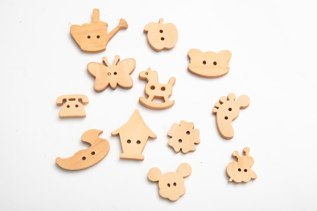 Wooden children's buttons of various shapes. tinting