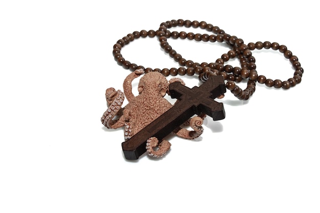 Wooden christian cross necklace and Octopus isolation on white background