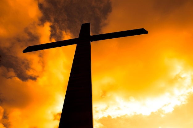 Wooden christian cross at the sunset